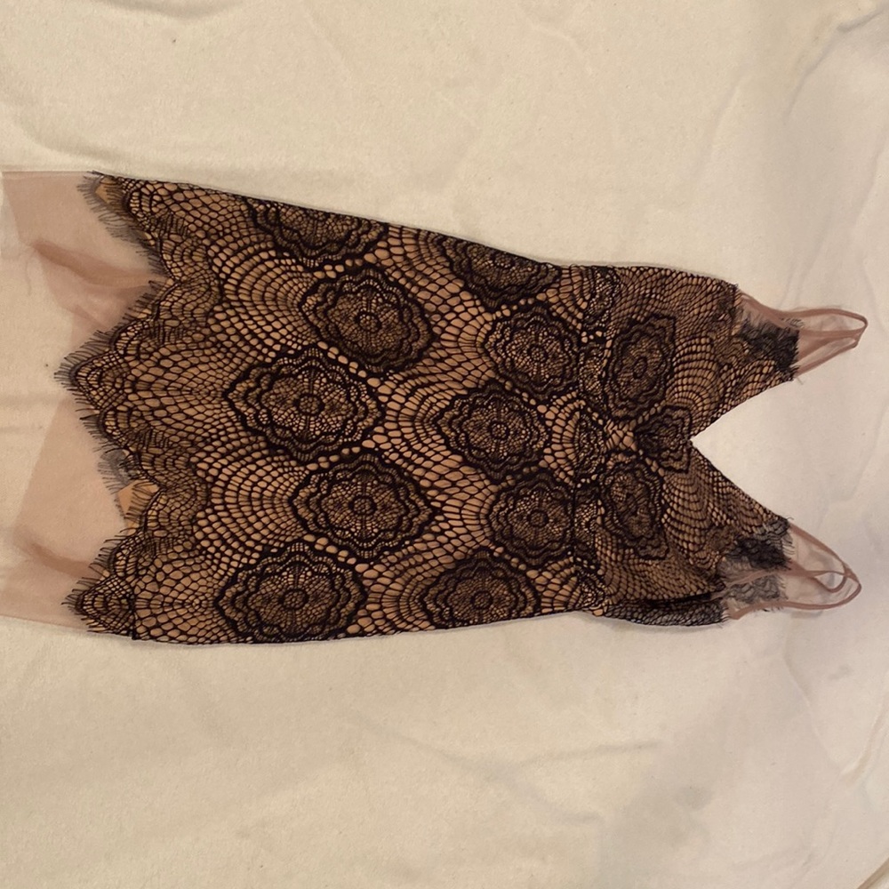 A Peach small nude and black lace dress